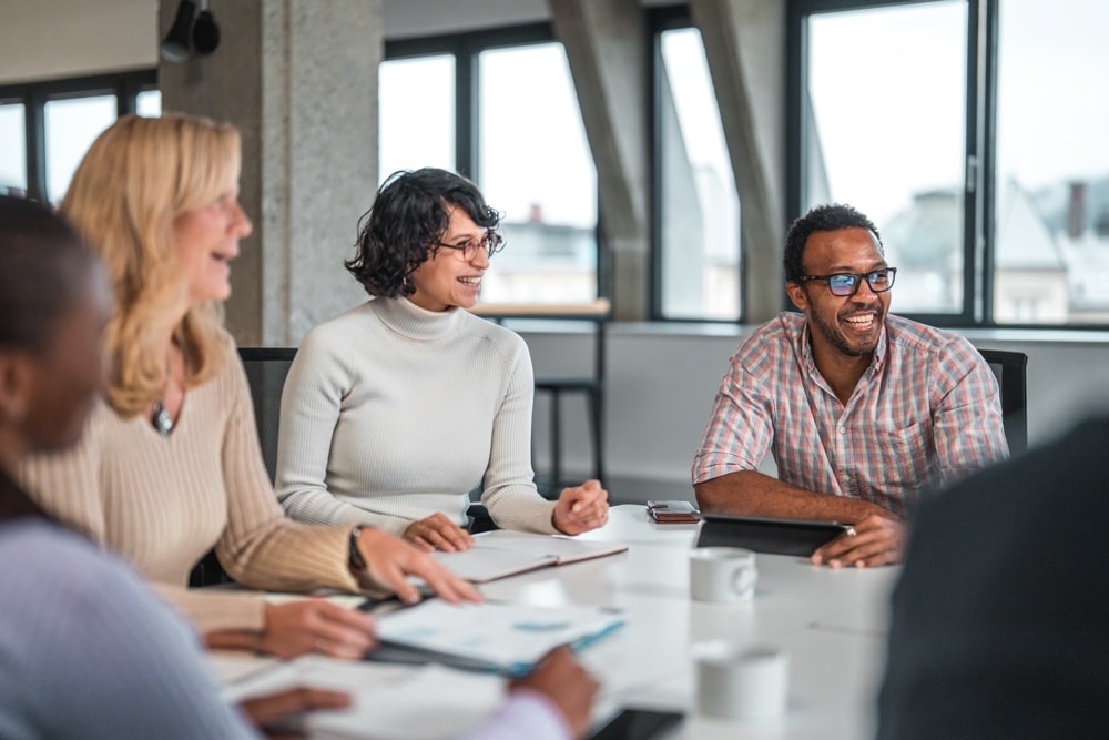 Coworkers Smiling at a Business Meeting