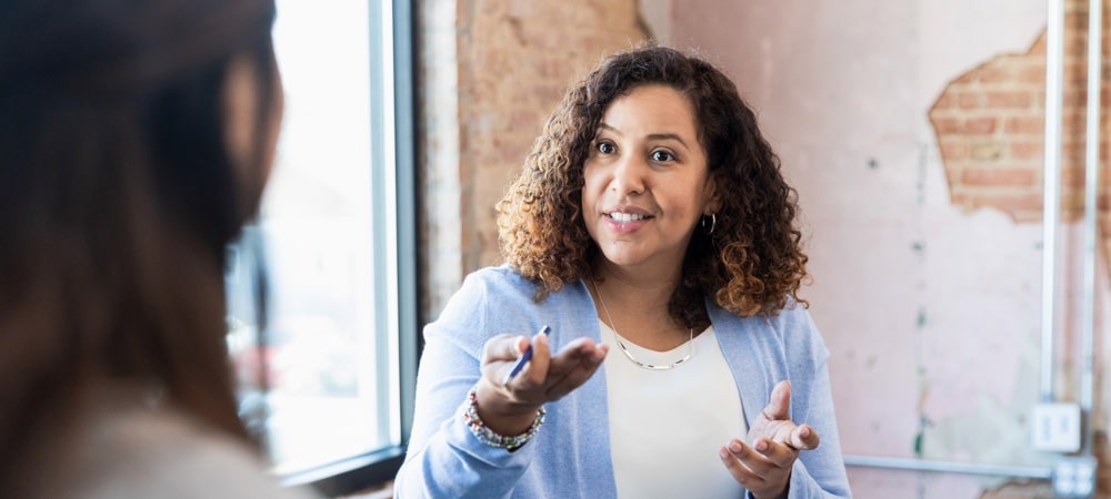 How to advocate for yourself, two women talking in an office