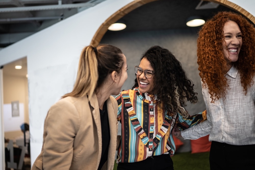 women supporting women, smiling, connecting