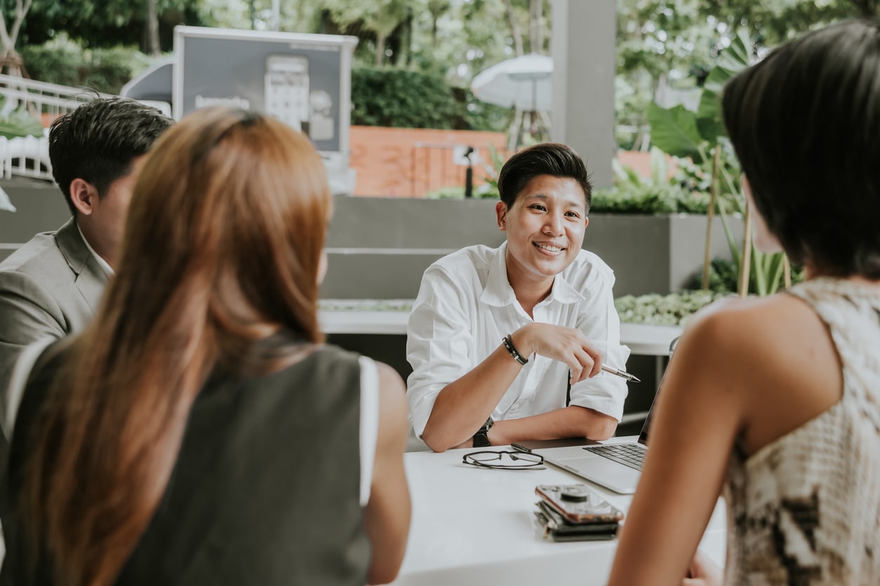 Managing a new team - group of employees talking