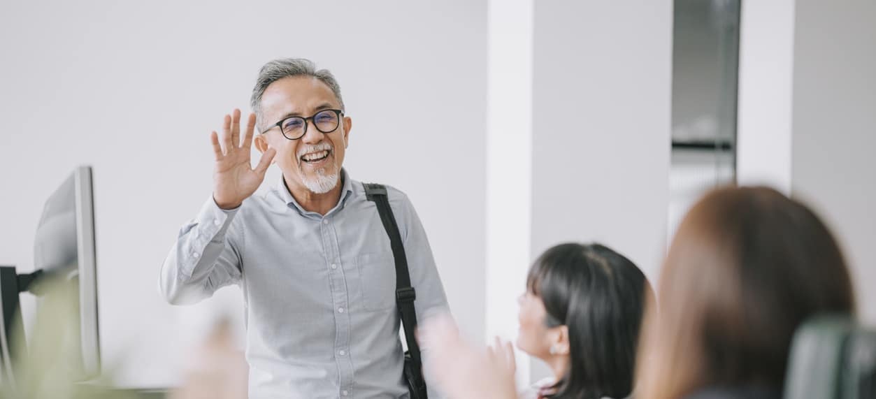 working colleague back to work greeting on each other in office